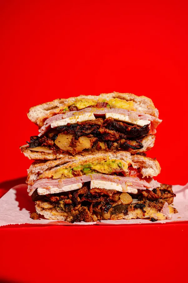 Torta cubana stacked tall with ham, milanesa, cheese and avocado
